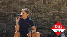 Female cyclist drinking from a water bottle on a hot day