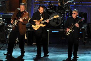 From left, Bob Spalding, Nokie Edwards and Don Wilson of the Ventures perform during the 2008 Rock and Roll Hall of Fame induction ceremony at New York's Waldorf-Astoria Hotel.