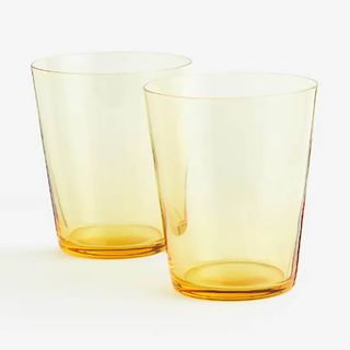 Yellow drinking glasses with clear design from H&M Home.