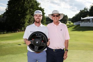 Ryan and Robert Gerard with a the BMW Charity Pro-Am trophy