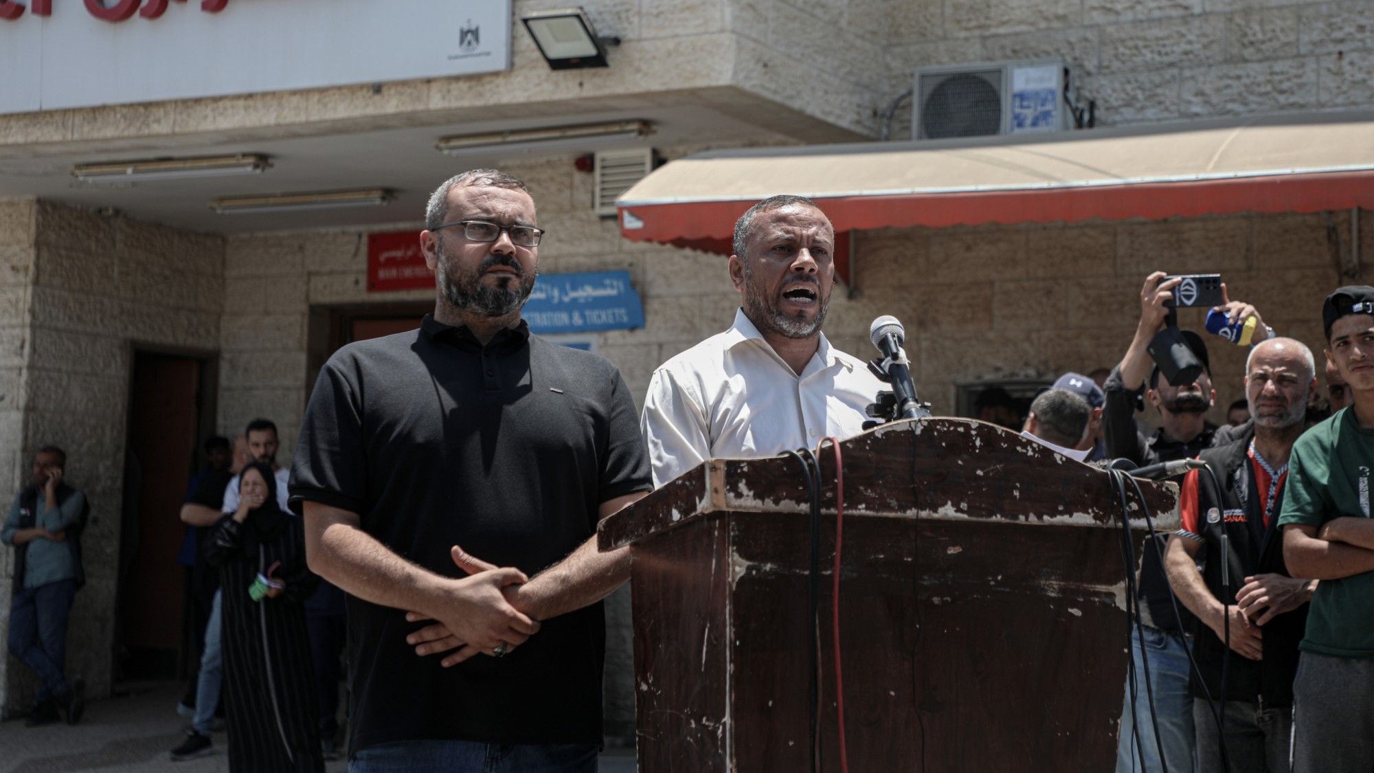 Ismail Al-Thawabta, head of Hamas's government media office, right, and Hazem Qassem, Hamas spokesperson, deliver a statement at at the Al-Aqsa Hospital, central Gaza, on Monday, July 6, 2026