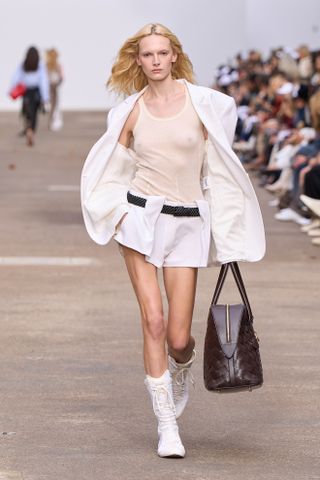 Models wears boxing trainers on the Stella McCartney spring/summer 2025 runway.