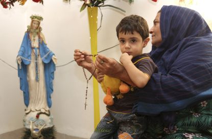An Iraqi Christian refugee, and child, in 2011.