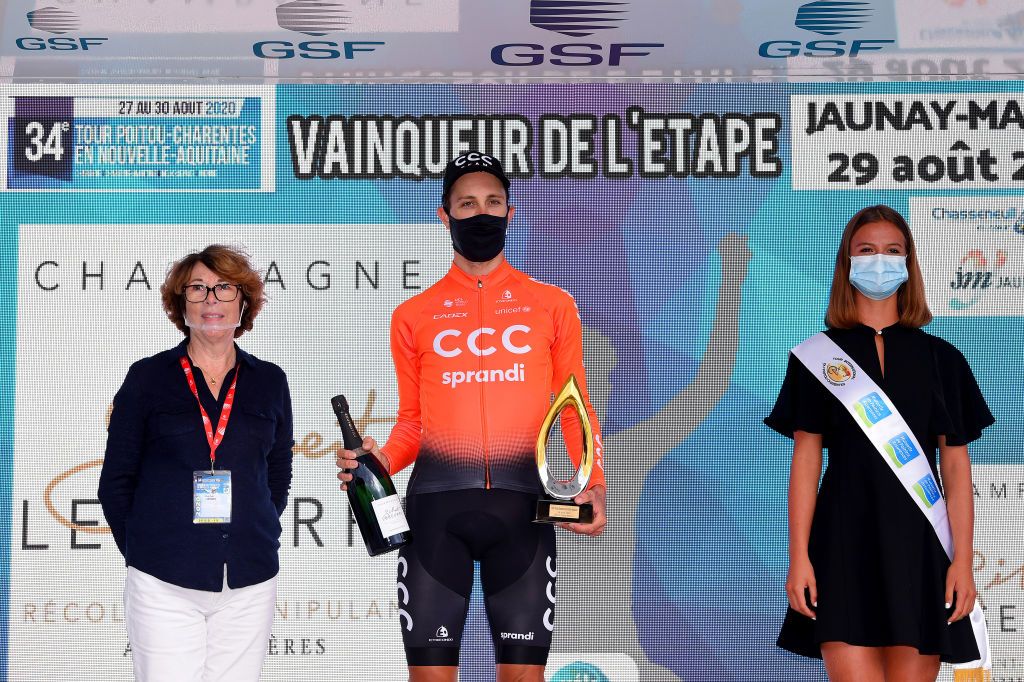 JAUNAYMARIGNY FRANCE AUGUST 29 Podium Josef Cerny of Czech Republic and CCC Team Celebration Trophy Flowers Hostess Miss Mask Covid safety measures during the 33rd Tour PoitouCharentes en Nouvelle Aquitaine 2020 Stage 3b a 225km Individual Time Trial from Futuroscope to JaunayMarigny ITT TourPoitouChtes on August 29 2020 in JaunayMarigny France Photo by Luc ClaessenGetty Images