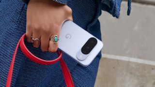 Google Pixel 10 in hand