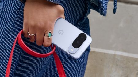 Google Pixel 10 in hand