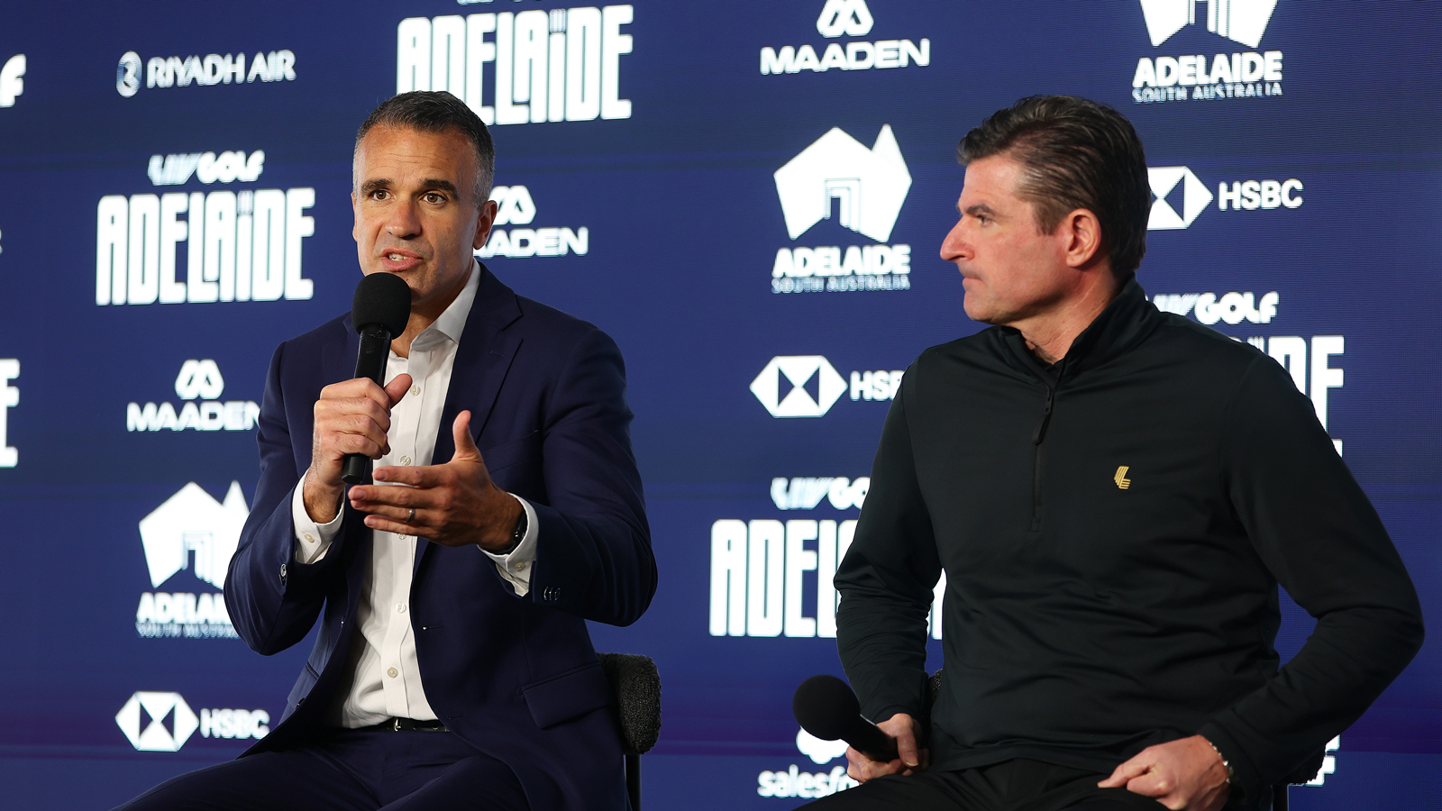 Peter Malinauskas and Scott O'Neil speak during a press conference