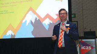 Sean Wargo presents the state of Pro AV in front of a massive display at InfoComm 2025. 