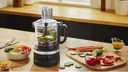 What can a food processor do - the KitchenAid 9-Cup Food Processor with sliced cucumber and other ingredients