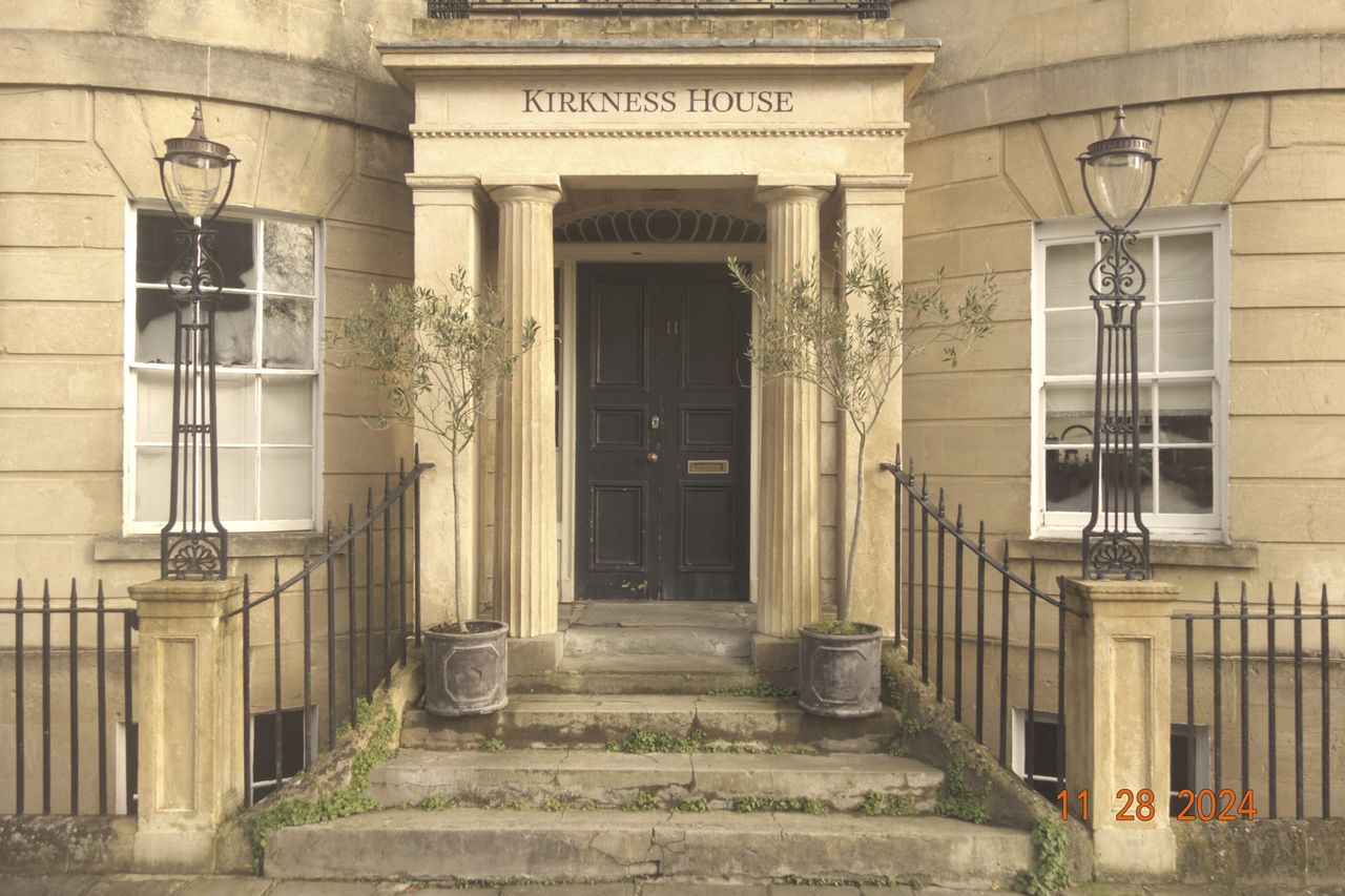 Old columned doorway in the city of Bath, UK, with retro photo picture effect