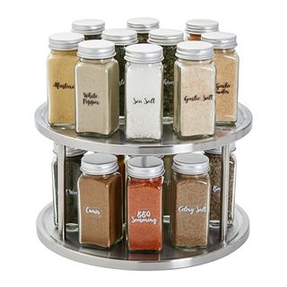 Stainless steel 2 Tier Lazy Susan Turntable Organizer with 10 spice and herb jars on each layer. There is a ridge around the edge to stop jars falling off