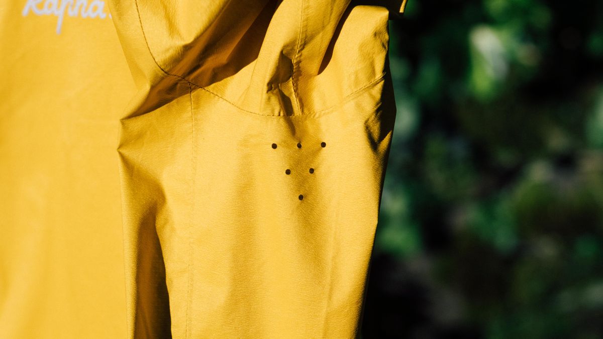 A yellow rapha core waterproof jacket