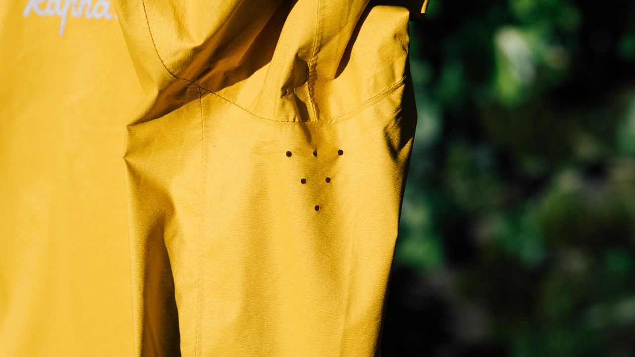 A yellow rapha core waterproof jacket
