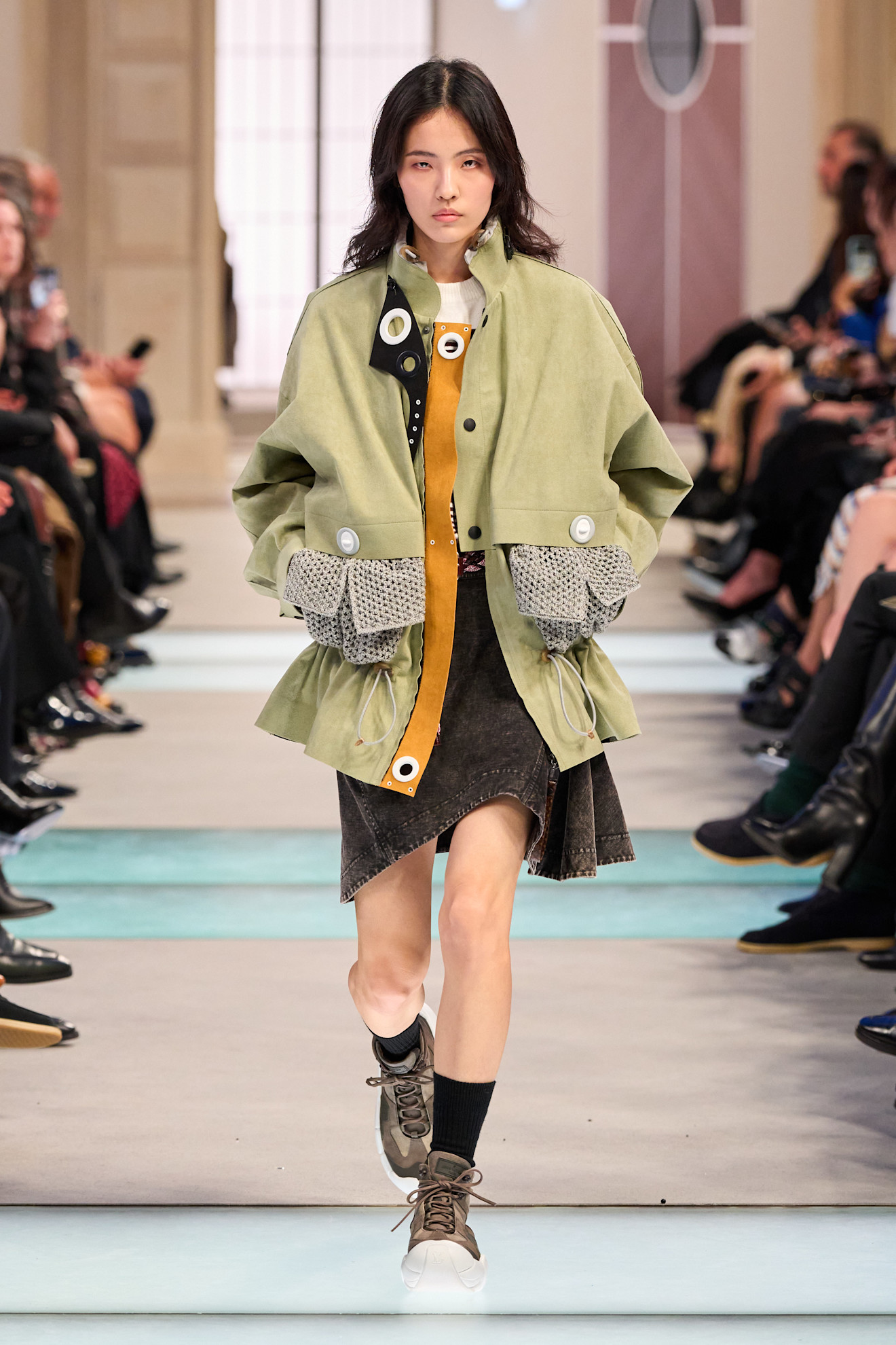 A model wore green on the Louis Vuitton Fall 2025 runway