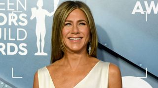 Jennifer Aniston with glowing skin at an awards ceremony