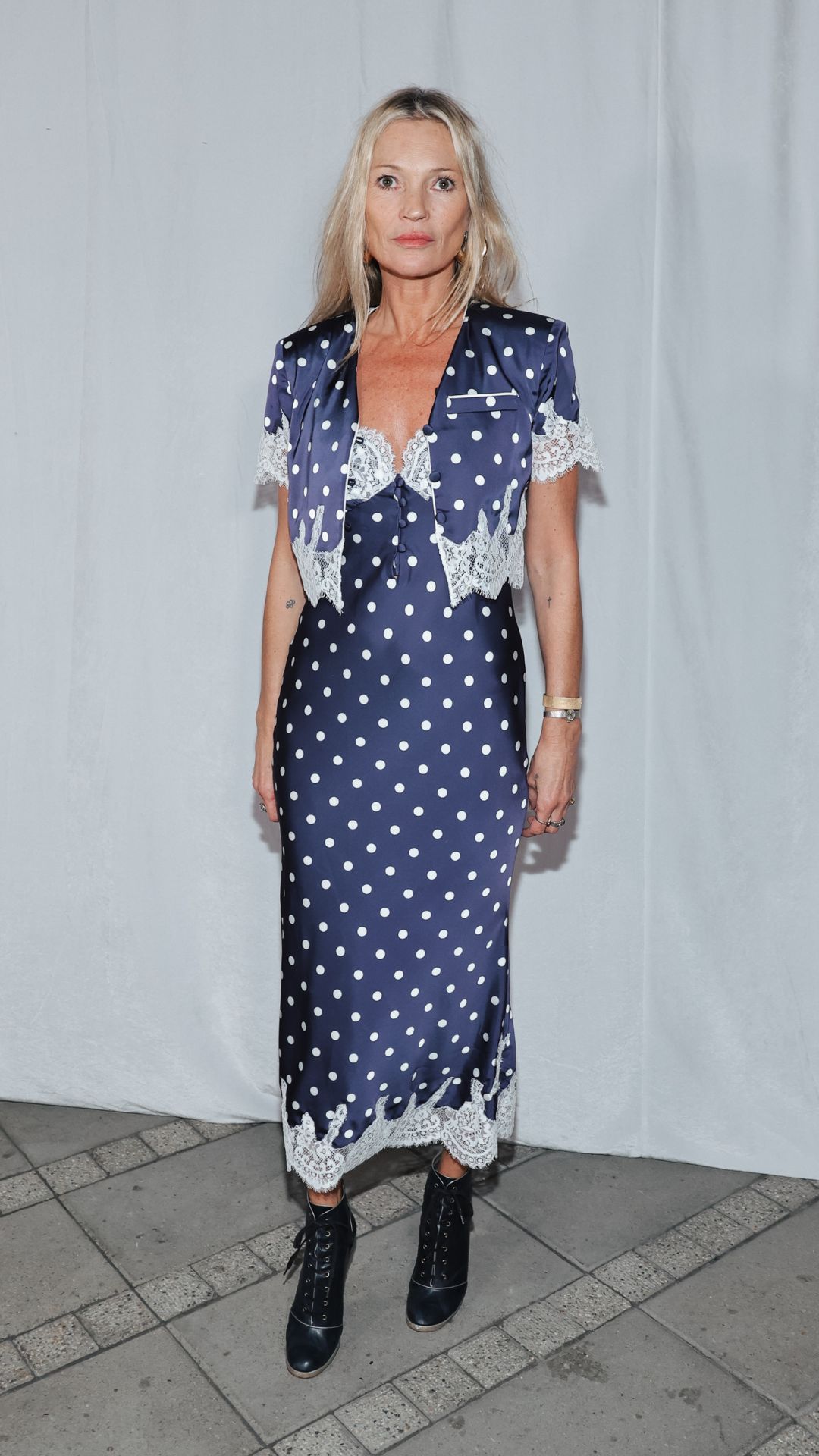 Kate moss wearing a polka dot dress and jacket