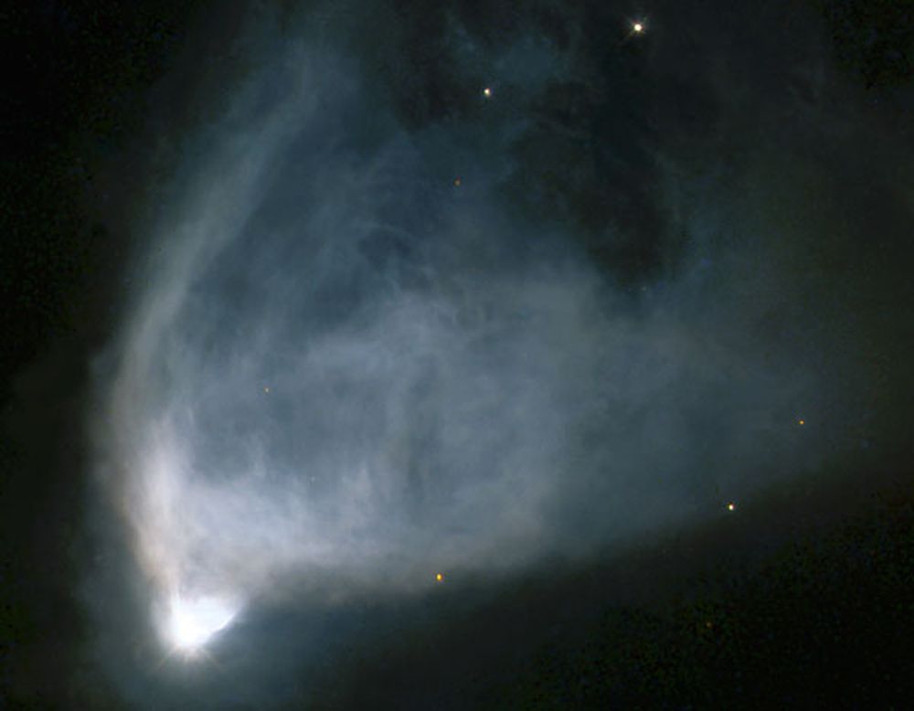 A strange &quot;faster-than-light&quot; experiment could help astronomers study distant objects like NGC 2261, a fan-shaped cloud of gas and dust that is illuminated by a star at its base.