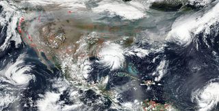 Storms and wildfires rage in the same satellite photo snapped by NASA's Aqua satellite.