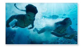 Two Avatar characters swimming underwater
