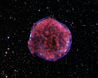 The Tycho Type IA supernova remnant, as imaged by NASA's Chandra X-ray Observatory. Low-energy X-rays (red) in the image show expanding debris from the supernova explosion and high energy X-rays (blue) show the blast wave, a shell of extremely energetic electrons. 