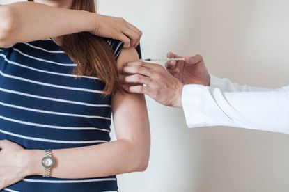Vaccine misinformation: A woman gets vaccinated