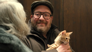 Howard Morris holds his new cat on Only Murders in the Building