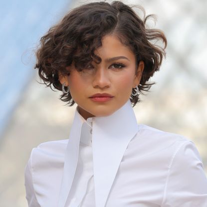 Zendaya attended the Louis Vuitton Fall 2026 fashion show in a white bubble-hem skirt set
