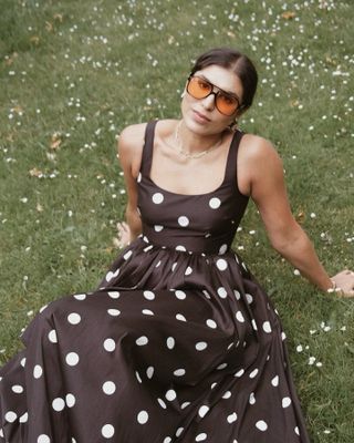 Influencer styles a polka dot dress.