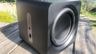 Samsung HW-S800 subwoofer on a wooden table outside