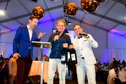 Actor Kyle MacLachlan presents a magnum of his wine Pursued by Bear at the gala event.