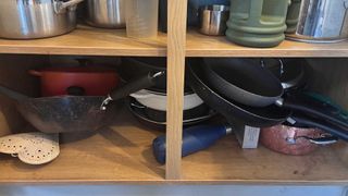 cluttered kitchen cupboard interior