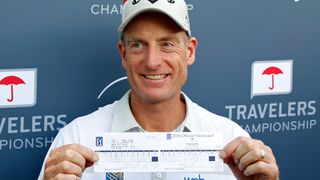 Jim Furyk poses with his scorecard after his record-breaking 58 at the 2016 Travelers Championship