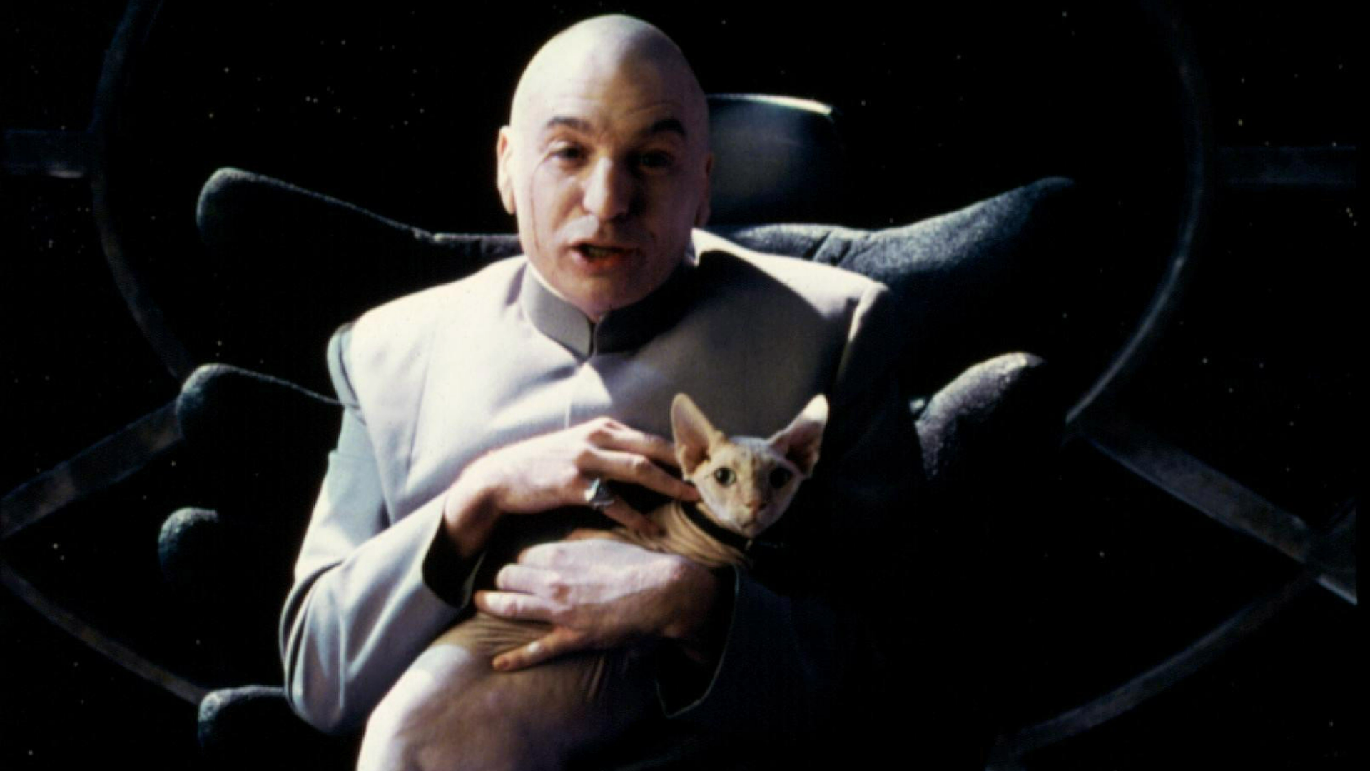 Dr. Evil holding and stroking Mr. Bigglesworth on his lap