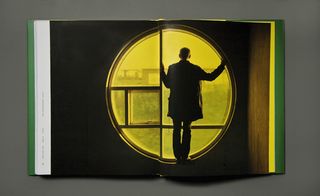 a spread from the book with an image of a man standing in front of a circular window