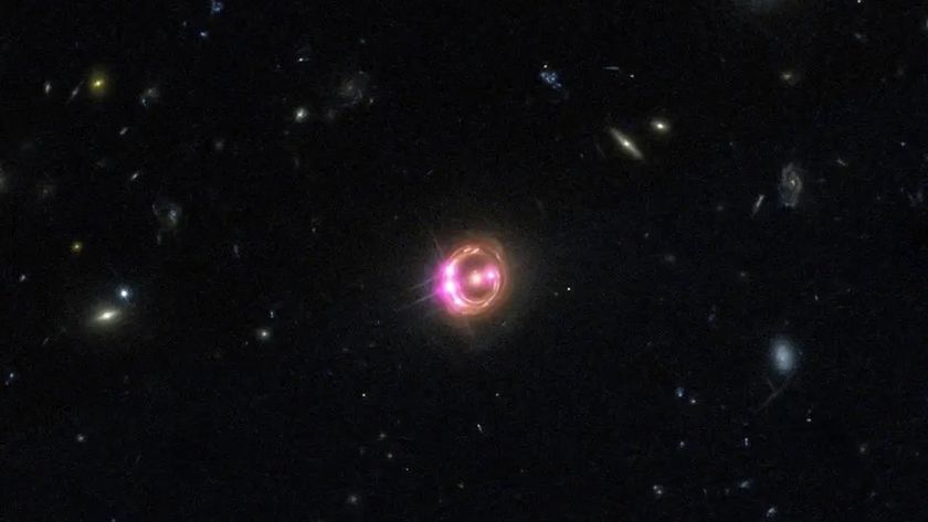 An image of a glowing orange and purple halo in outer space