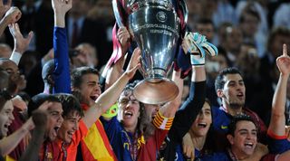 ROME, ITALY - MAY 27: Captain Carles Puyol of Barcelona lifts the trophy at the medal ceremony after the UEFA Champions League final between Barcelona and Manchester United at the Stadio Olympico on May 27, 2009 in Rome, Italy. (Photo by Etsuo Hara/Getty Images)