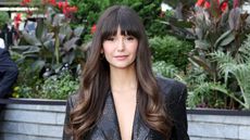 nina dobrev on a floral background