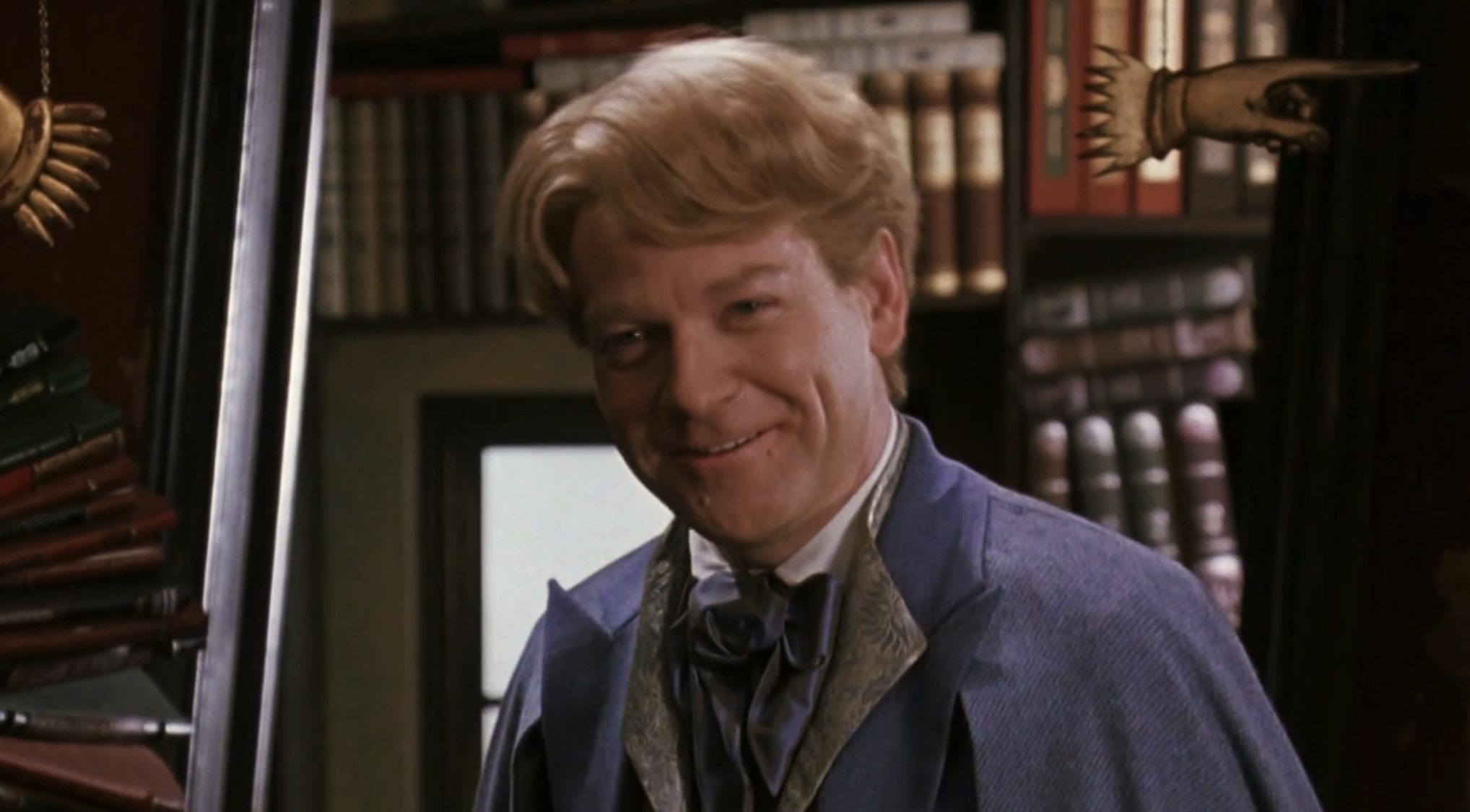Lockhart smiling in Diagon Alley in Harry Potter 2