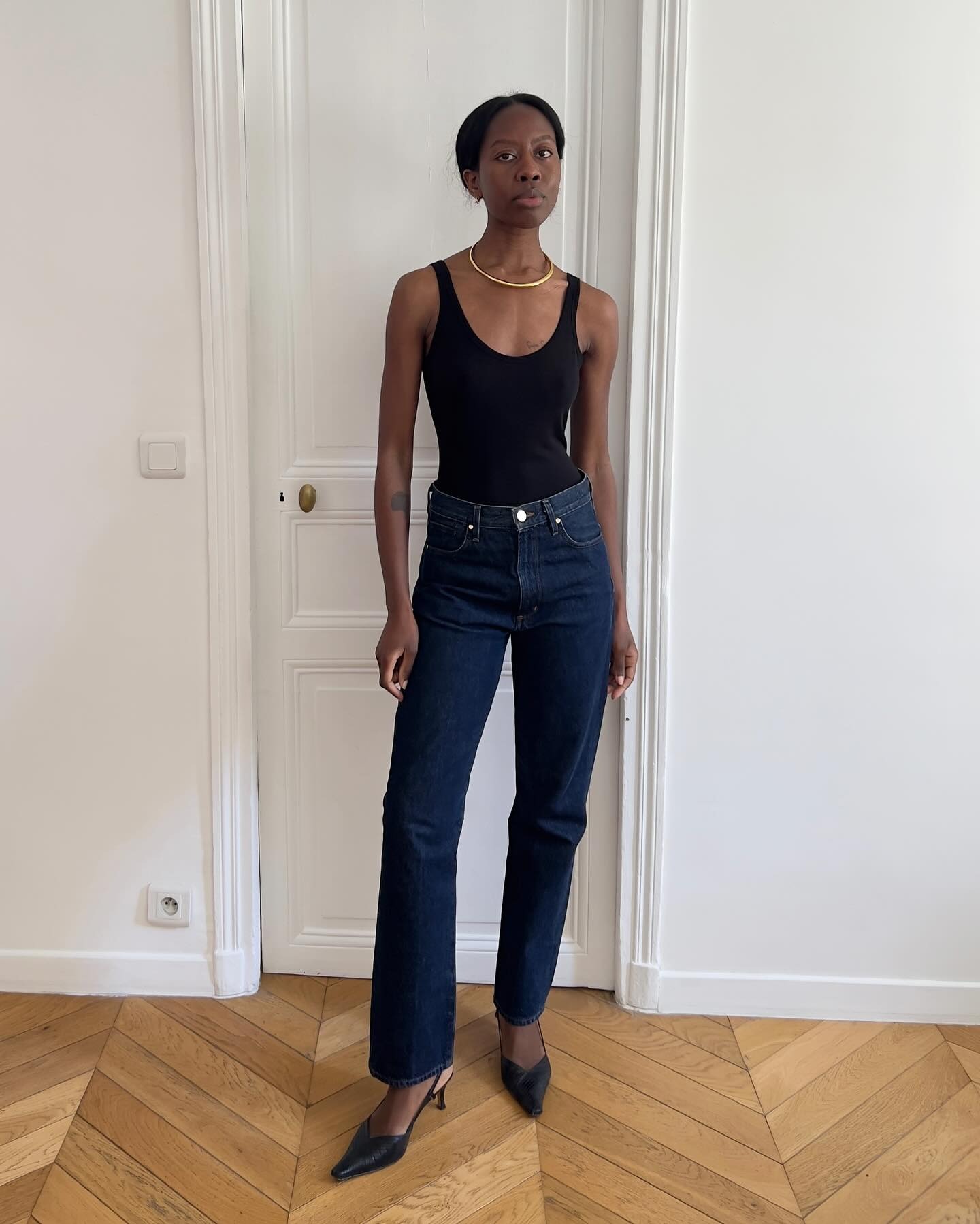 French influencer wearing cigarette jeans and kitten heels