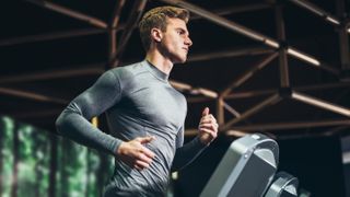a photo of a man running on a treadmill