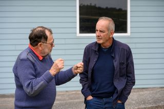 Kevin McCloud speaks to the homeowner outside the converted boat house