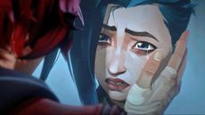 A close up of a crying Jinx as Vi cups her right hand on Jinx's face in Arcane season 1
