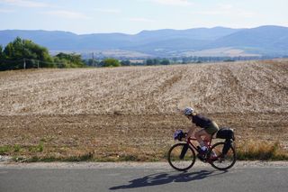 Image shows Anna cycling towards Anna walking Košice in Slovakia