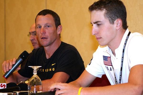 Taylor Phinney (foreground) looks a little perturbed while Armstrong answers a question