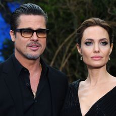 london, england may 08 brad pitt and angelina jolie attend a private reception as costumes and props from disneys maleficent are exhibited in support of great ormond street hospital at kensington palace on may 8, 2014 in london, england photo by anthony harveygetty images