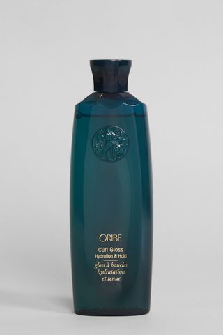 Oribe Curl Gloss Hydration & Hold shot in Marie Claire's studio, one of the best hair glosses