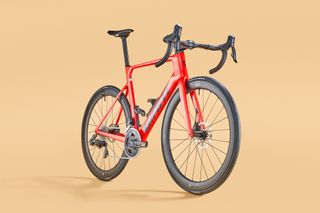 Giant Propel Advanced Pro 1 carbon road bike on an orange background