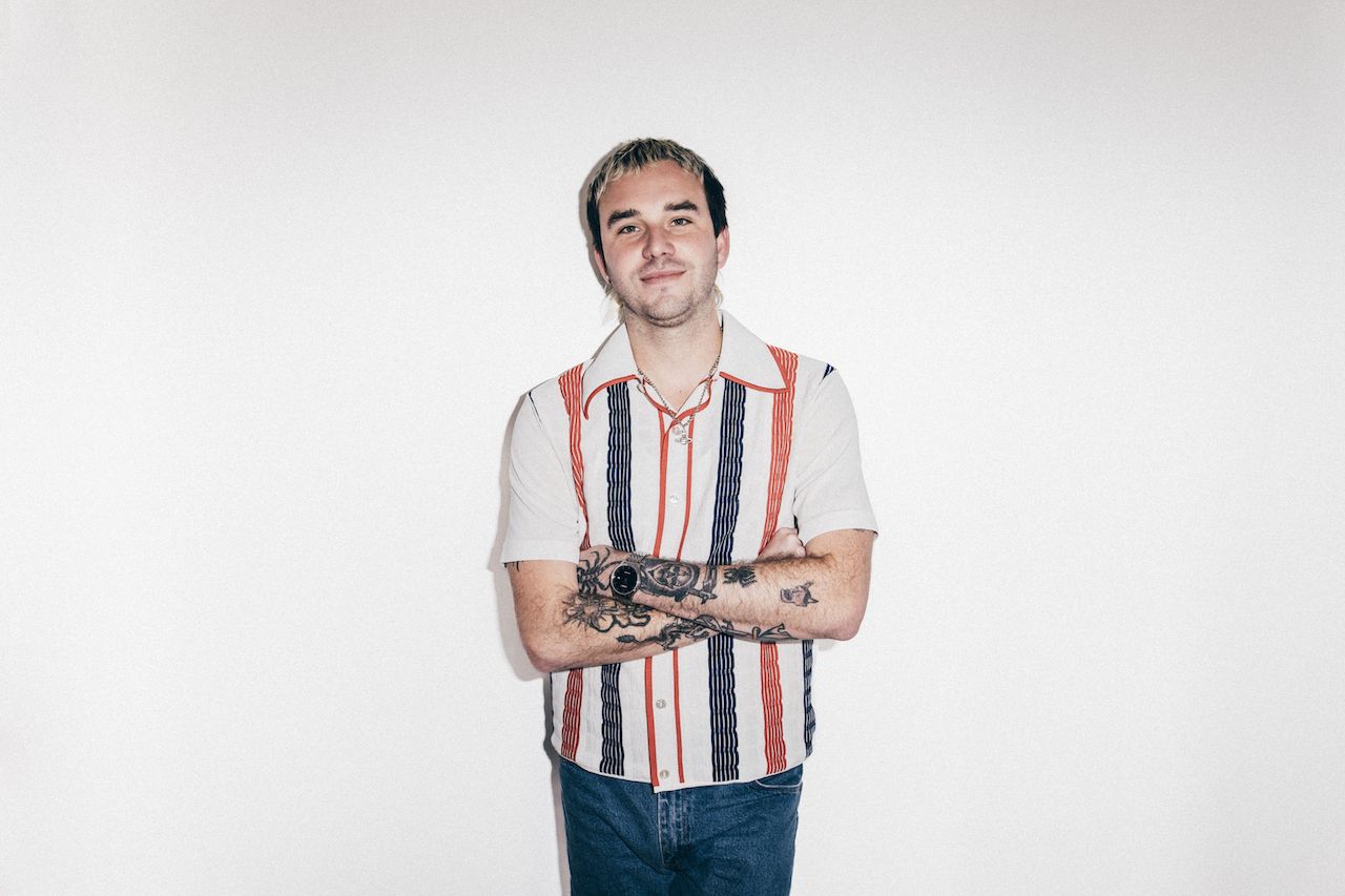Portraits of Amyl And The Sniffers band members against a white background