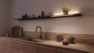 modern wooden kitchen with floating shelf and accent lighting