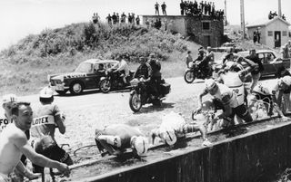 Riders filling up on water during the 1958 Tour de France